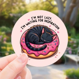 Waiting for Inspiration Lazy Cat Sticker – Cute Black Cat in Sprinkle Donut | Funny vinyl Sticker for Cat Lovers, Artists & Daydreamers