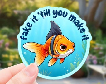 Fake It Till You Make It Goldfish Sticker – Funny Motivational Vinyl Decal with Shark Fin Design