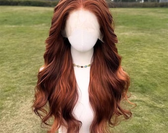 May include: A long, wavy wig with a lace front, displayed on a mannequin head. The wig features a blend of reddish-brown and auburn tones, with a natural-looking hairline. A delicate necklace with colorful gemstones adorns the mannequin's neck. The wig's style is voluminous.