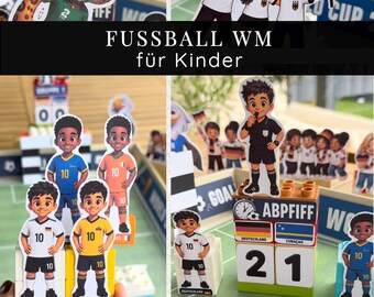 May include: A set of football-themed paper cutouts featuring cartoon characters, referees, and players in various national jerseys. The collection includes blocks with the text ABPFIFF, flags, and a football graphic, designed for a tabletop display.