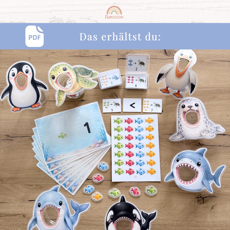 May include: A printable educational game set featuring cartoon sea animals including a penguin, turtle, pelican, seal, shark, dolphin, and orca with open mouths. Includes number cards, fish tokens, and a sheet with rows of colorful fish illustrations.