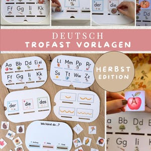 May include: Educational learning cards for children featuring German alphabet letters, grammatical articles, and phonics exercises. The set includes white rectangular cards with illustrations, text, and slots for sorting small square image tiles.