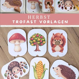 May include: A set of six white rectangular activity boards with rounded corners, each featuring autumn-themed illustrations including a mushroom, an apple tree, a squirrel, a spider, a corn cob, and a hedgehog, all with small holes for play.