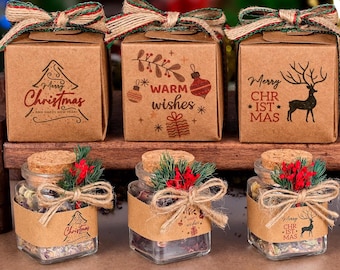 May include: A festive Christmas display featuring eight gift boxes and jars. The boxes are brown with holiday-themed graphics and ribbon bows. The jars are clear, filled with contents, and adorned with festive decorations, perfect for holiday gifting.