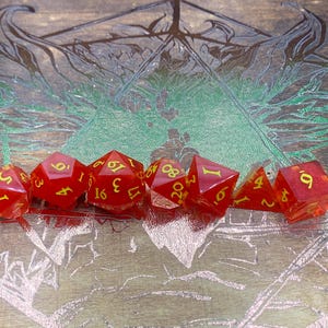 Red dice with yellow inking
