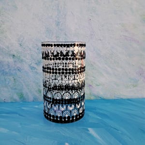 May include: A white ceramic mug with a black handle and the text "But First, Coffee" in a handwritten style. The mug is likely 12-16 ounces, perfect for a morning beverage. Ideal for coffee or tea lovers.