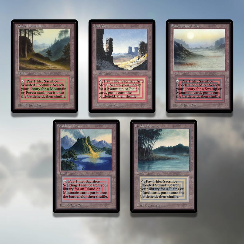 May include: Five Magic: The Gathering cards with illustrations of landscapes. Each card has a text box with the card's name, mana cost, type, and abilities. The cards are: Wooded Foothills, Arid Mesa, Bloodstained Mire, Scalding Tarn, and Flooded Strand.