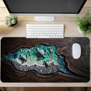 May include: A rectangular desk mat featuring a high-resolution print of three sea turtles swimming in turquoise ocean water surrounded by a dark brown wood grain border, with a pebble beach shoreline and white sea foam detailing.