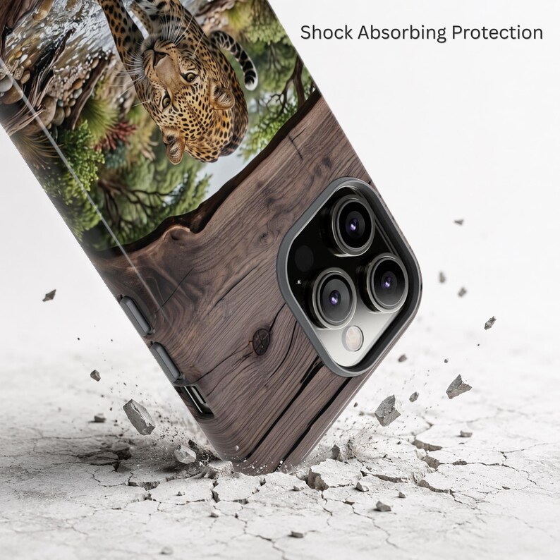 May include: A smartphone case featuring a printed image of a leopard in a forest setting on the upper portion and a dark brown wood grain pattern on the lower portion. The text Shock Absorbing Protection is visible near the top right corner.