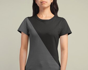 May include: A black and gray t-shirt with a diagonal color block design. The shirt has short sleeves and a crew neck.