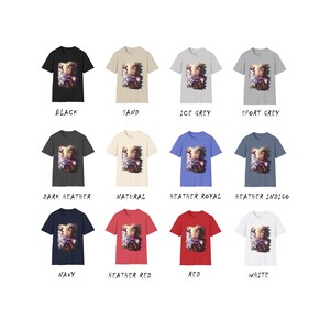 May include: A selection of t-shirts in various colors, featuring a graphic print of a person with a colorful, abstract design. The colors include black, sand, ice grey, sport grey, dark heather, natural, heather royal, heather indigo, navy, heather red, red, and white.