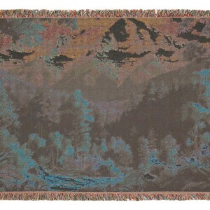 A beautiful vivid display of a mountainous background with a forest setting. Stitched scenic display of nature makes this comfy woven blanket perfect for all nature enthusiasts, and as a home decor gift. Great for a cozy night in.