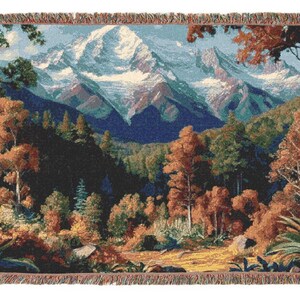 A beautiful vivid display of a mountainous background with a forest setting. Stitched scenic display of nature makes this comfy woven blanket perfect for all nature enthusiasts, and as a home decor gift. Great for a cozy night in.