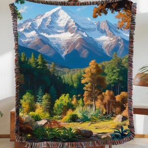 A beautiful vivid display of a mountainous background with a forest setting. Stitched scenic display of nature makes this comfy woven blanket perfect for all nature enthusiasts, and as a home decor gift. Great for a cozy night in.