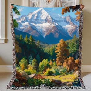 A beautiful vivid display of a mountainous background with a forest setting. Stitched scenic display of nature makes this comfy woven blanket perfect for all nature enthusiasts, and as a home decor gift. Great for a cozy night in.
