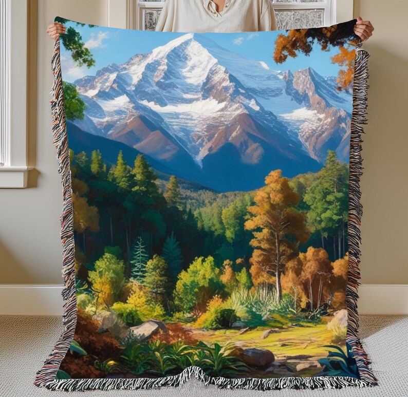 A beautiful vivid display of a mountainous background with a forest setting. Stitched scenic display of nature makes this comfy woven blanket perfect for all nature enthusiasts, and as a home decor gift. Great for a cozy night in.