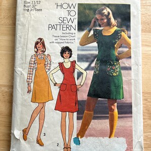 May include: Vintage Simplicity sewing pattern 7075, featuring illustrations of dresses. The pattern includes instructions for two figure types and seven sizes. The cover has the text "How to Sew Pattern" and includes a tissue lesson chart.