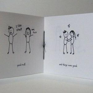 May include: A hand-drawn illustration of two stick figures. The first figure says "I like stuff" and the second figure says "me too". The caption below the figures says "good stuff". The second page of the illustration shows the two stick figures holding hands and the caption says "and things were good."