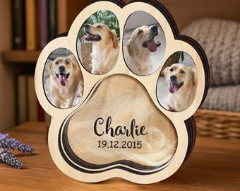 Könnte beinhalten: Ein hölzerner Pfoten-Fotorahmen mit vier ovalen Öffnungen für Bilder eines Golden Retrievers. Der Rahmen hat einen dunkelbraunen Rand und enthält den Namen "Charlie" und das Datum "19.12.2015" in der Mitte.