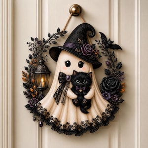 May include: A decorative wall hanging featuring a cream-colored ghost wearing a black witch hat with a purple rose, holding a black kitten. The ghost is surrounded by a wreath of black leaves, purple flowers, and a small lantern with a lit candle.