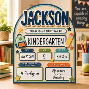 May include: A wooden arched sign for the first day of kindergarten featuring the name JACKSON in large blue letters. It includes sections for date, age, height of 112 cm, career goal of a firefighter, and interests like dinosaurs, soccer, and drawing.