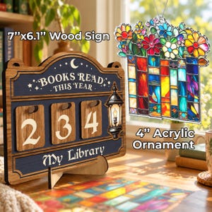 May include: A 7-inch by 6.1-inch wood sign with the text 'BOOKS READ THIS YEAR' and 'My Library' featuring a lantern graphic and number tiles, alongside a 4-inch acrylic ornament depicting a colorful stained glass flower bouquet.