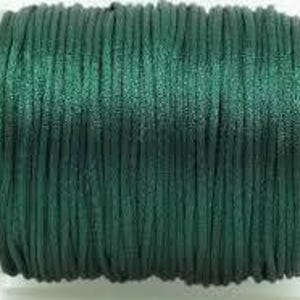 May include: A spool of dark green waxed cotton cord. The cord is smooth and shiny, and it is perfect for crafting and jewelry making.