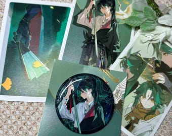 Xiao from Genshin Impact's Autumn Seasonal Collection: Xiao postcards and Xiao badges.