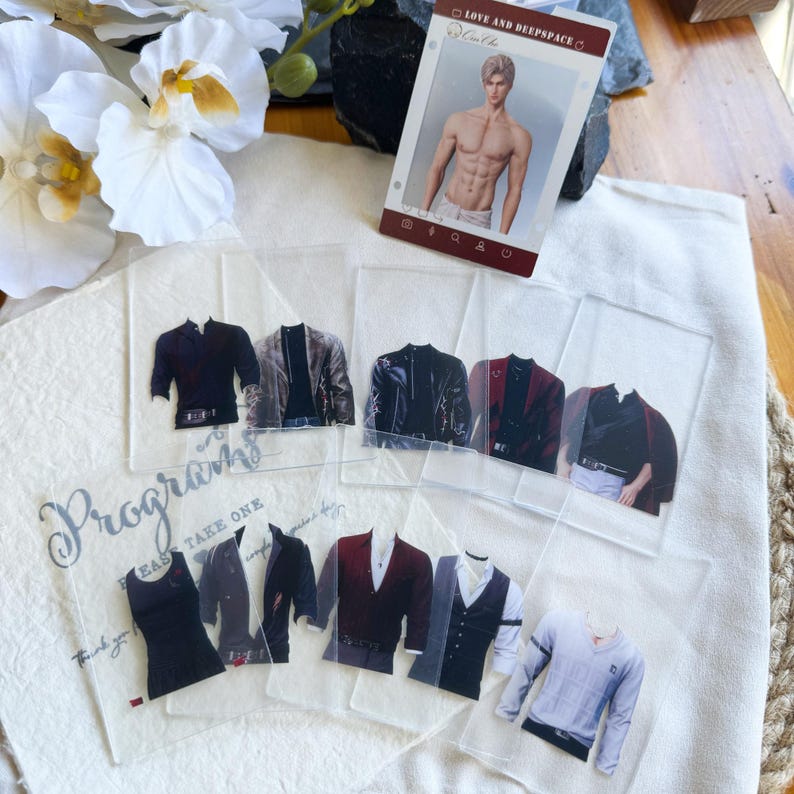 May include: A collection of transparent cards featuring various men's fashion items, including jackets, vests, and shirts. A card with a male figure is also present. The word "Programs" is visible on one of the cards.