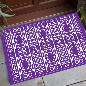 Felpudo morado "Keep Off": moderna mezcla de microfibra y poliéster