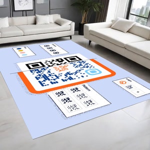Peut inclure: Un tapis bleu et blanc avec un motif de code QR. Le tapis a un fond bleu clair avec une bordure blanche. Le code QR est au centre du tapis et est entour&eacute; d'une bordure blanche. Le tapis a &eacute;galement un petit logo dans le coin inf&eacute;rieur droit.