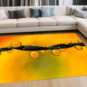 May include: A yellow and green abstract rug with a black line and yellow circles. The rug has a blurred background.