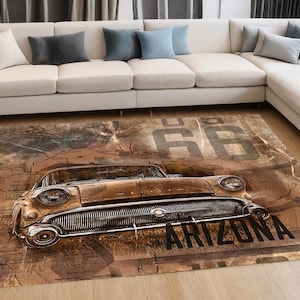 May include: A rectangular area rug featuring a vintage car graphic in shades of brown and tan. The design includes the text 66 and ARIZONA overlaid on a map-like background. The rug has a detailed illustration of a classic car front end.