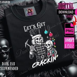 May include: Black sweatshirt with a graphic of two skeleton figures in military-style attire, one holding a pickaxe. The text "Let's Get Crackin'" is displayed in white. The design includes Christmas ornaments and the words "Digital Download Only".