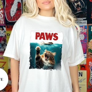 Comfort Colors® PAWS Cat Parody T-Shirt – Funny Movie Poster Kitty Tee – Soft Cotton Unisex Shirt for Cat Lovers, Gifts & Humor Fans