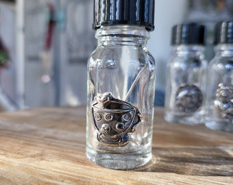 reclaimed fine silver charm on glass needle bottle, tiny cup of hearts, lots of love