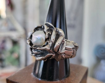 artisan fine silver rose ring boasts sculpted leaves and luminous creamy pearl center