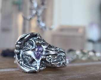 Artisan fine silver Crescent moon setting holds crystal pointed star with purple cz wide band ring