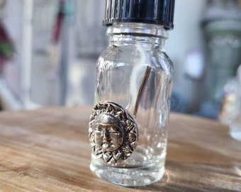 reclaimed fine silver charm on glass needle bottle, sleeping sunshine motif