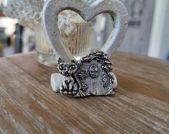 reclaimed fine silver rare earth magnet - its a little kitty! sitting outside the tiny gnome door- needleminder