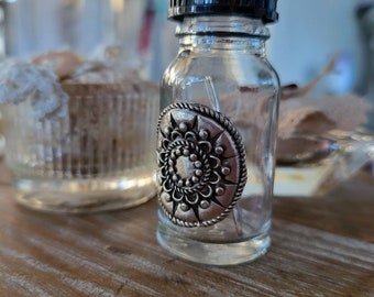 reclaimed fine silver charm on glass needle bottle, circles on circles textured effect