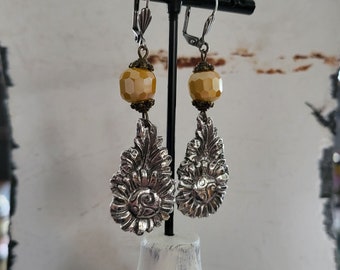 Artisan crafted fine silver sunflowers dangle from a bit of sunny crystal wire earrings