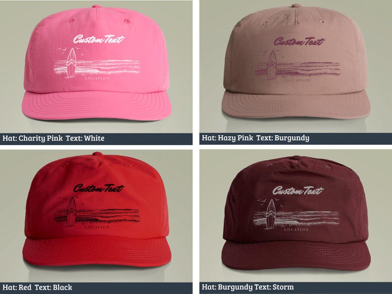 May include: Four different colored baseball caps with a surfboard graphic and the text "Custom Text" on the front. The caps are in the colors charity pink, hazy pink, red, and burgundy. The text on the caps is in the colors white, burgundy, black, and storm.