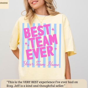 Yellow t-shirt with "BEST TEAM EVER" and custom name in pink and blue.