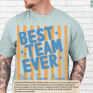 Light blue t-shirt with "BEST TEAM EVER" in large blue lettering.