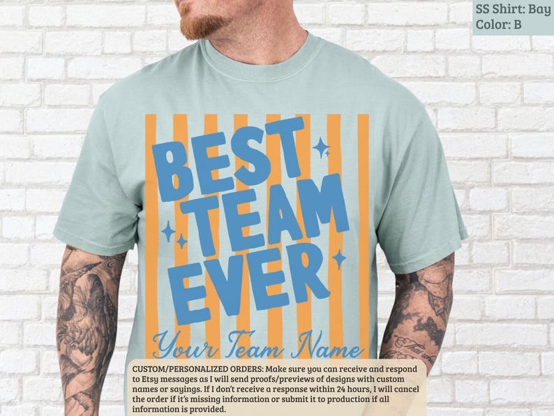 Light blue t-shirt with "BEST TEAM EVER" in large blue lettering.
