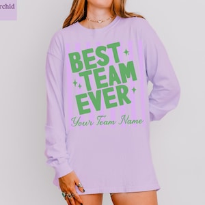 Purple long-sleeve shirt with "BEST TEAM EVER" and "Your Team Name" text.