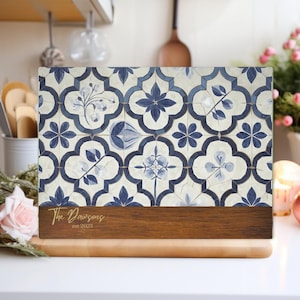 May include: A blue and white patterned glass cutting board with a wooden base. The board has a personalized inscription that reads "The Dawsons est 2025".