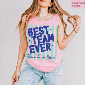 Pink tank top with "BEST TEAM EVER" in blue and green stripes.