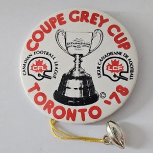 CFL Football 1978 Grey Cup Toronto Pinback Button w/hanging Football - Irwin Specialties Canada 3in